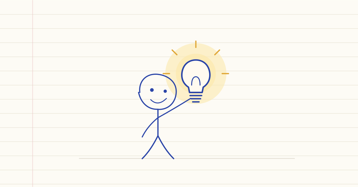 Notebook drawing of a smiling stick figure holding up a glowing light bulb